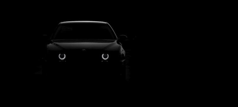 Car with headlights switching on